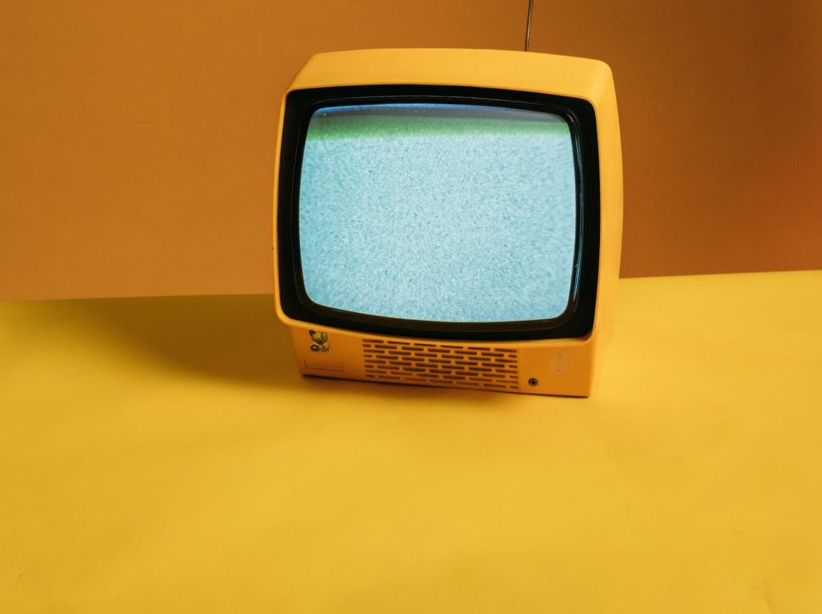 a+tiny+yellow+tv+on+yellow+background